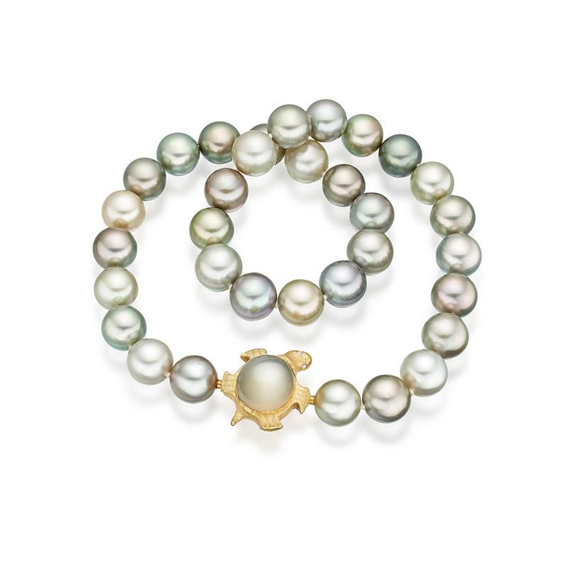 Tahitian pistachio pearls with interchangeable moonstone tortoise clasp in 18 carat gold